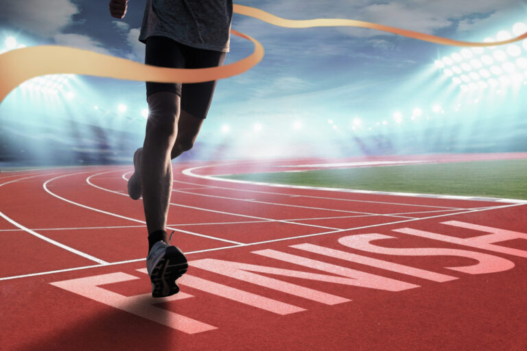 Runners running towards the finish line. Success concept.